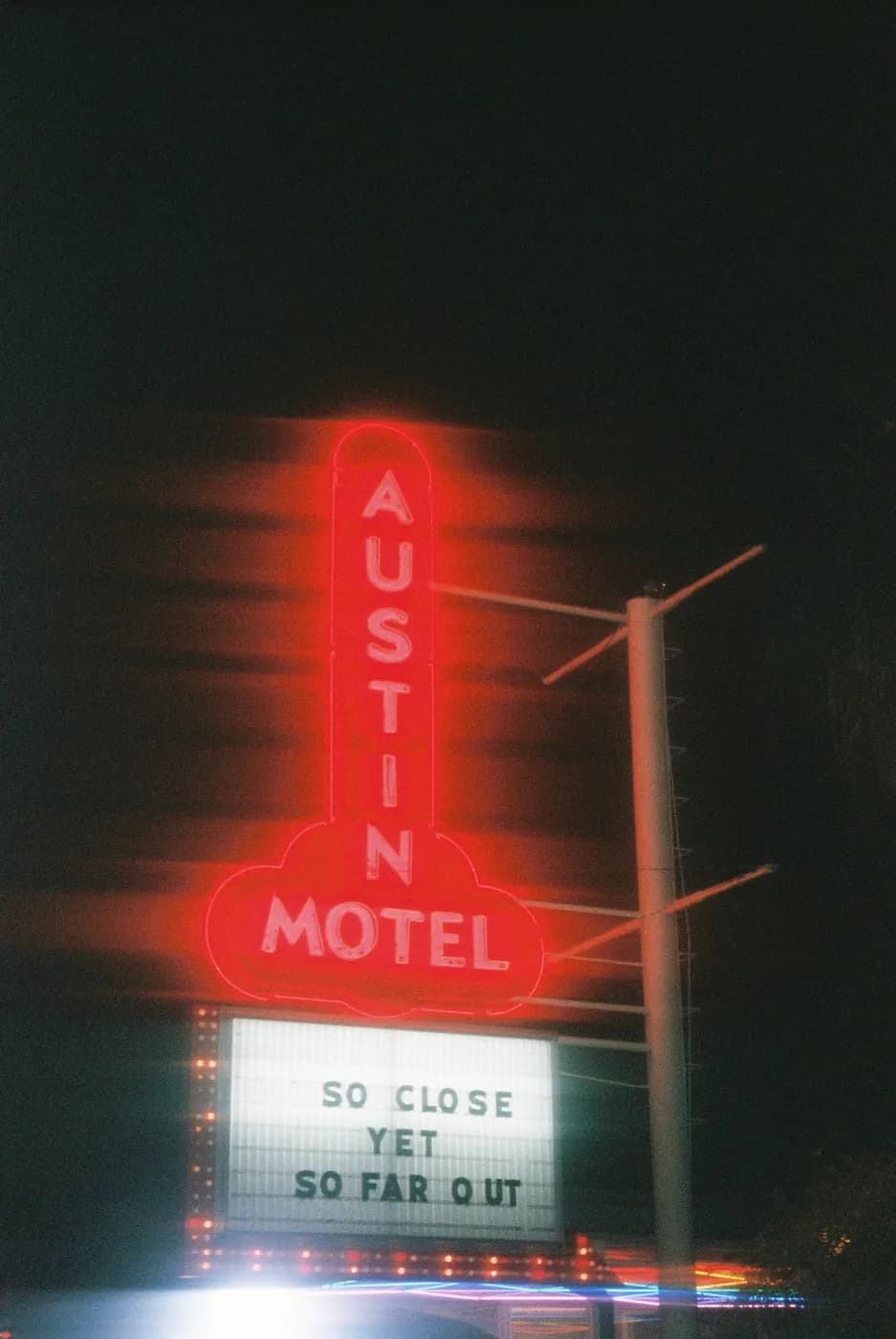 The Austin Motel sign lit up at night