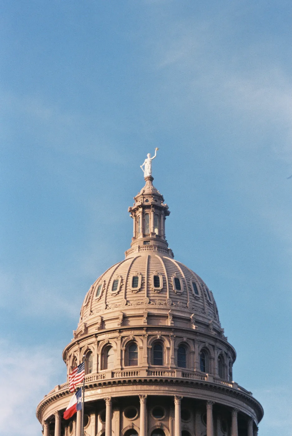 The Texas Capitol dome against a clear sky