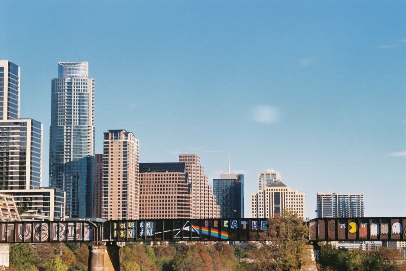 The Austin skyline behind the rail bridge